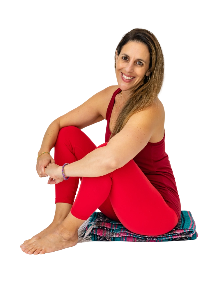 Lauren Ohayon seated cross-legged in a red outfit