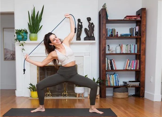 Lauren Ohayon demonstrating a core and pelvic floor exercise at home