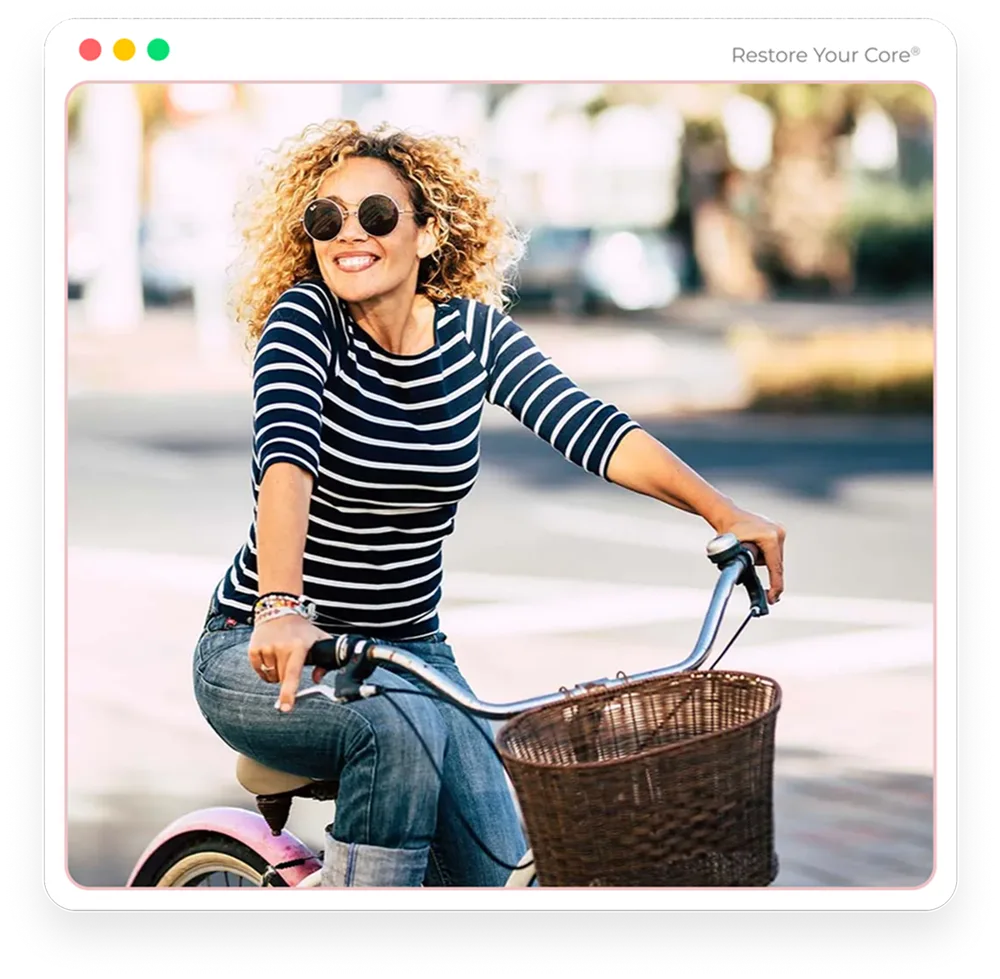 A woman riding a bicycle outdoors